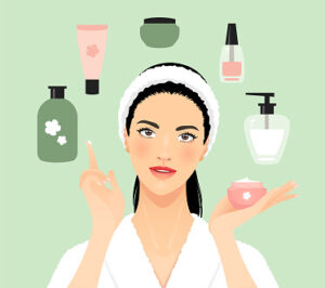 Young woman in a bathrobe applying a beauty product.